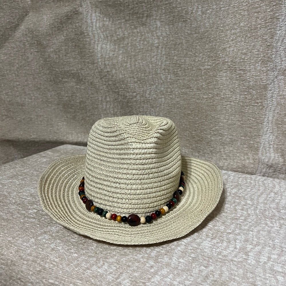 Tan straw hat with wire rim. One-of-a-kind wood and semi-precious stones band.